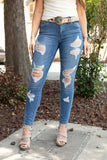 MID RISE MID WASH DISTRESSED SKINNY JEANS