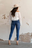 LIGHT MID WASH RIPPED SKINNY ANKLE JEANS